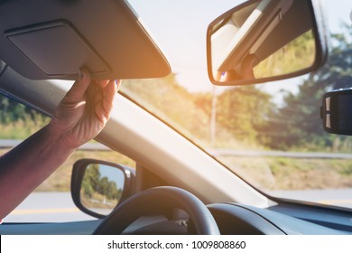 Lady Adjust Sun Visor While Driving Car On Highway Road - Interior Car Using Concept