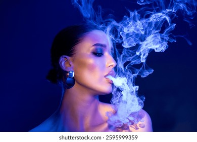 Lady blowing smoke swirls around her face, smoking e-cigarette, posing on dark studio background being illuminated by light - Powered by Shutterstock - Get 15% off with code: PIKWIZARD15
