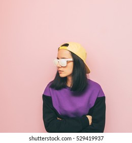 Lady In A Cap And Sweater. The Style Of The 90's. Winter Fashion. New Collection. Minimalism.