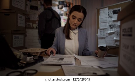 Lady Cop With Coffee Examining Case, Reading Witness Statements, Evidence List