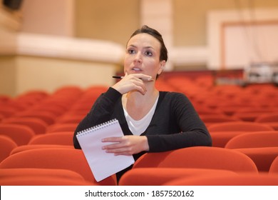 A Lady Directing Stage Performance