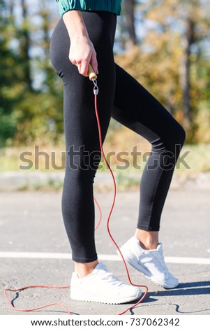 Lady do exercises with jumping rope