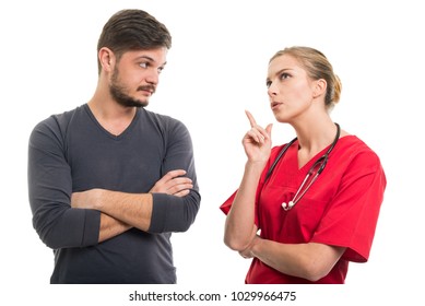 Lady doctor explaining something to male patient isolated on white background