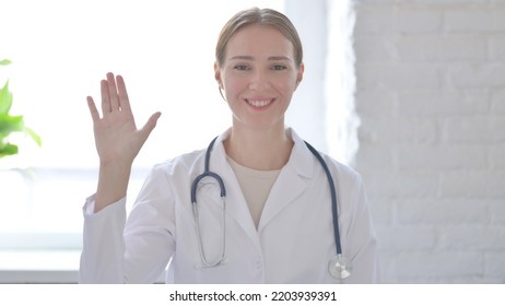 Lady Doctor Waving Hand To Say Hello