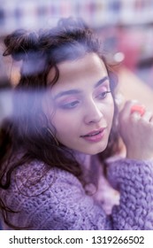 Lady Dreamy Looking. Cute Attractive Young Woman With Dark Wavy Hair And Unusual Purple Outfit