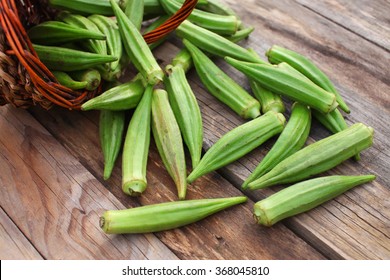 Lady Fingers Or Okra Over Wooden Table Background