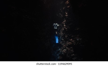 Lady Free Diver In Swimsuit Free Diving In An Underwater Cave