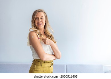 Lady Getting Vaccinated Immunity To Covid-19, Recommended Inoculation, Coronavirus Program, Gray Background With Empty Space. Female Patient Showing Shoulder With Band Aid After Shot