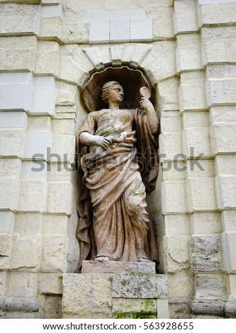 Lady God statue on the stone wall at ancient castle in Saint Petersburg, Russia. Saint Petersburg is one of the world's youngest great cities.