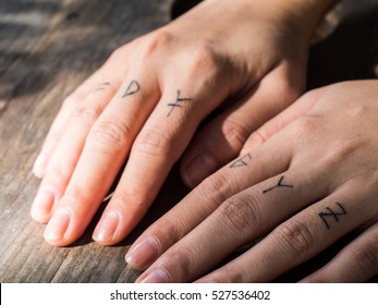 The lady hand with alphabet tattoo,small tattoo