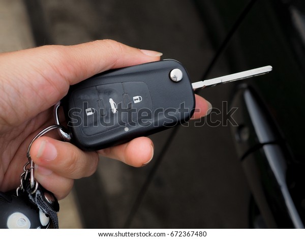 lady hand with car key\
with modern concept of transportation, grab of confident and\
believe in oneself.