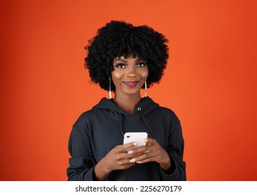 Lady holding a mobile phone - Shutterstock ID 2256270179