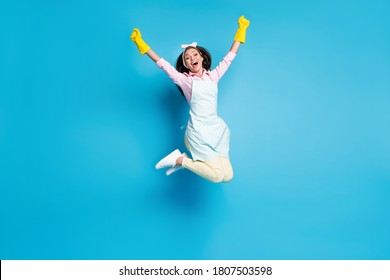 Lady Housewife Jumping On Blue Background