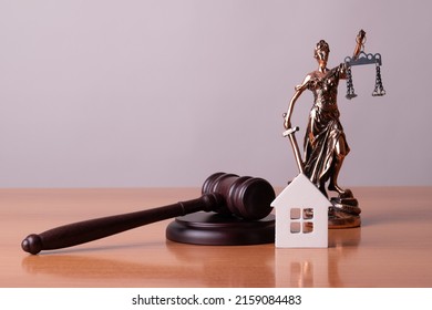 Lady Justice, Judge gavel and house. Concept of real estate auction or dividing house when divorce, division of property, real estate, law system.