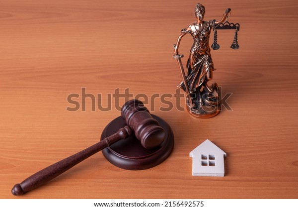 Lady Justice, Judge gavel and house. Concept of\
real estate auction or dividing house when divorce, division of\
property, real estate, law\
system.