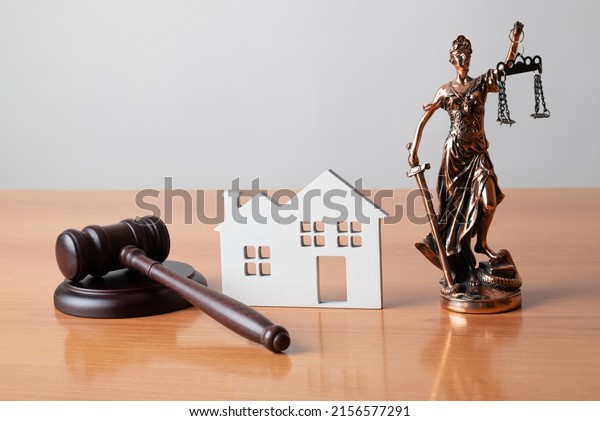 Lady Justice, Judge gavel and house. Concept of
real estate auction or dividing house when divorce, division of
property, real estate, law
system.