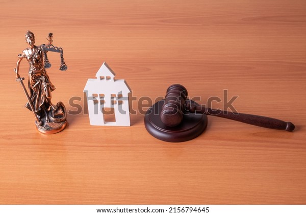 Lady Justice, Judge gavel and house. Concept of\
real estate auction or dividing house when divorce, division of\
property, real estate, law\
system.