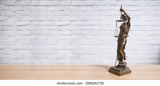 Lady Justice Or Justitia Statue On Desk - Legal Law Jurisdiction