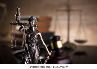 Lady Justice. Law Symbols In Bokeh Background.