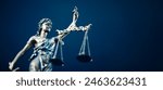 Lady Justice statue in law on blue background. Law and justice concept