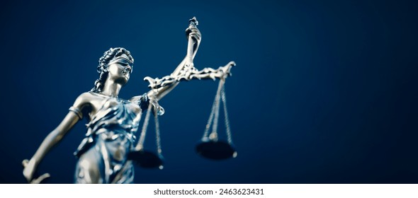 Lady Justice statue in law on blue background. Law and justice concept