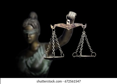 Lady Justice Or Themis (God Of Justice) Isolated On Black Background