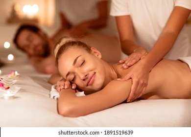 Lady And Man At Spa Receiving Relaxing Massage And Aromatherapy Enjoying Lying With Eyes Closed On Beds Indoors. Luxury Body Care And Relaxation, Wellness And Beauty Ritual Concept. Selective Focus