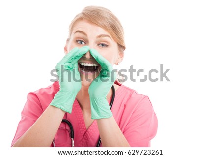 Lady medical nurse wearing scrubs  yelling out loud  isolated on white background with copy text space