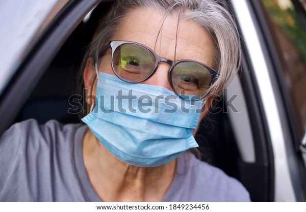 Lady with mouth and nose protection mask\
against infection