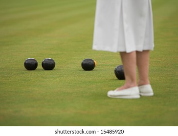 Lady Player In A Game Of Lawn Bowls.