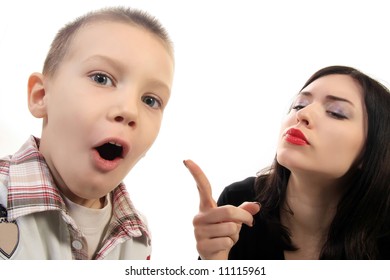 lady pointing at a naughty boy who is surprised