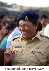 A Lady Police Officer On Duty Guiding People With Smiling In Face In Wari. Shot At Nigdi In Pune On 17 June 2017.