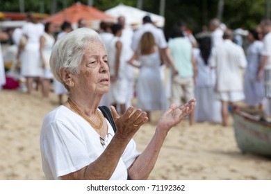 Lady praying in the beach, the day of new year - Powered by Shutterstock