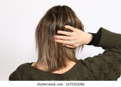 A lady with present day and colored hairdo and long hairs and highlights and streaks - Shutterstock ID 1675323286