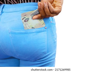 lady putting few United Arab Emirates notes into her back pocket. Removing money from pocket, hold money