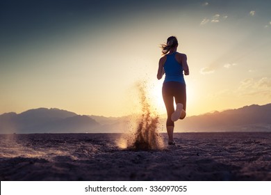 Lady Running In The Desert At Sunset