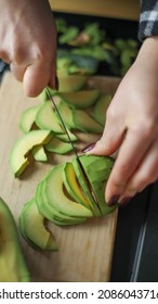 Lady Slicing Avocado, Avocado Recipe, Selective Focus ,vertical Photo