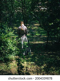 A Lady Standing Alone In The Forest