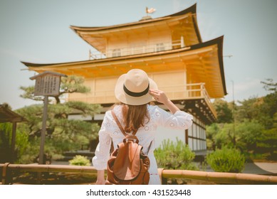 Lady Tourist Is Watching Kinkaku-ji Temple In Kyoto, Japan