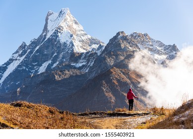 A lady trekker is enjoying Machapuchare and Mardi peak view 