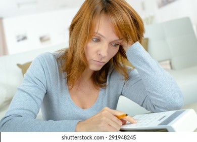 Lady Using Calculator, Stressed