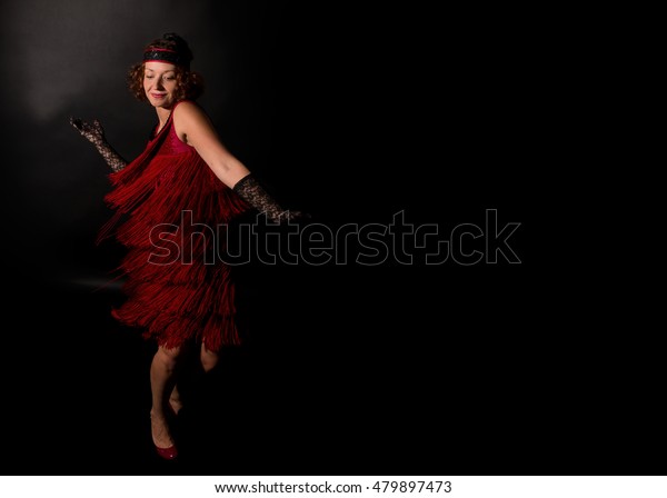lady in vintage dress\
dancing charleston