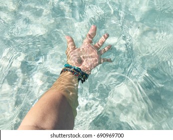 Lady's Hand under the crystal clear water