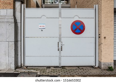 Laeken, Brussels Capital Region / Belgium - 09 26 2019: closed Garage door with a sign forbidden to park - Shutterstock ID 1516653302