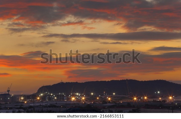 Laem Chabang\
Industrial Estate in the twilight sky background, Deep Sea Port in\
Chonburi Province,\
Thailand.