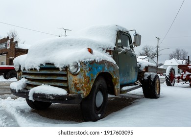 Lafayette, Indiana - January 30 2021: A Vintage Pickup Truck Is Covered In Snow, During A Bad Winter Storm.