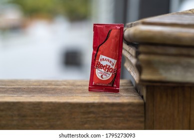 LAFAYETTE, L.A. / USA -  MARCH 3, 2020: A Closeup View Of Franks Red Hot Sauce, In A Small Individual Packet.