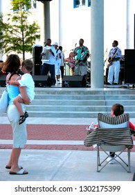 Lafayette, Louisiana,USA,  Mother Dancing With Child To The Music Of Corey Ledet And The Zydeco Band, Downtown Alive!, June 11, 2004