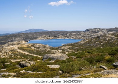 Lagoa Comprida located in the Serra da Estrela Natural Park and the large lake formed by the dam