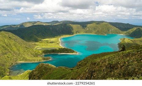 "Lagoa do Fogo" translates to "Fire Lagoon" on the Azores Island of São Miguel, Portugal. The cool water of the lake is turquoise. - Shutterstock ID 2279254261